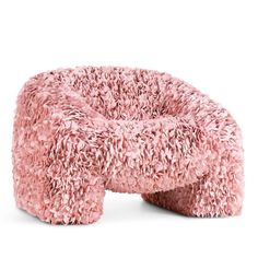 a pink chair that is made out of fuzzy material and has a small hole in the middle