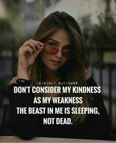 a woman sitting at a table with her hand on her head and the words don't consider my kindness as my weakness, the beast in me is sleeping, not dead