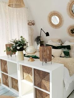 a bedroom with wicker furniture and mirrors