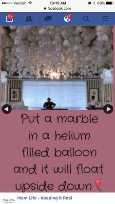 a man sitting in a room with balloons on the ceiling and a quote written below