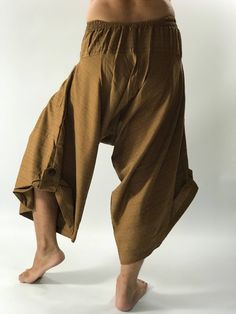 "Super soft Coconut button up cotton pants High quality and durable - Premium lCotton Samurai trousers styler are completely handmade using the best quality cotton fabric 100% super soft. The half of the waist is elastic which they are easy to take on or off. Single pocket. buttons on the side of each leg to keep the hem of each leg off the ground. Sizing: One size fits most Measurement: Waist: 26\" - 32\" Hip: up to 50\" Length: 36\" (90CMS) Shipping : - All item will be shipped in 1 business d Traditional Cotton Straight Leg Bottoms, Cotton Trousers With Buttons, Baggy Wide Leg Cotton Harem Pants, Casual Cotton Wide Leg Pants With Buttons, Cotton Wide Leg Yoga Pants With Relaxed Fit, Casual Cotton Wide Leg Pants For Festivals, Baggy Wide Leg Bottoms For Meditation, Traditional Straight Leg Cotton Bottoms, Cotton Straight Pants With Buttons