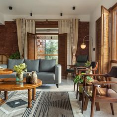 This peaceful Bengaluru bungalow magically silences its surroundings | Architectural Digest India Architectural Digest Living Room, Kusha Kapila, Indian Home, Wooden Dining Tables, Main Bedroom, Stone Flooring, Architectural Digest