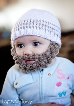 a baby with a beard wearing a white knitted hat