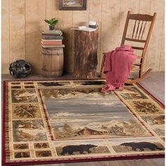 an area rug with bears on it in front of a wooden wall and chair next to a potted plant