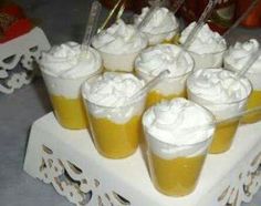 there are many cups with whipped cream on them