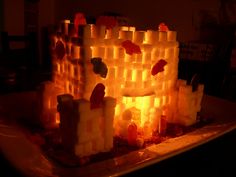 a castle made out of candles sitting on top of a table