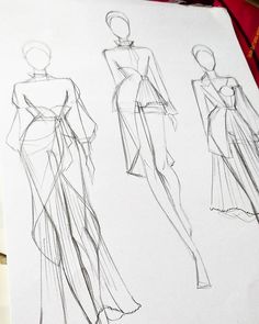 three different types of dresses are drawn on paper