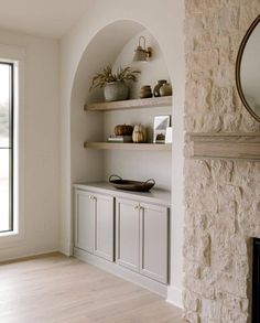 a living room filled with furniture and a fire place