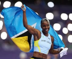 a woman holding a flag in her right hand