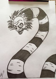 a pencil drawing of a snake with its head in the middle of it's mouth