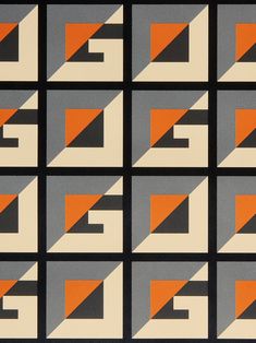 an orange and grey pattern with black squares