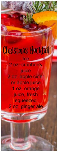 a christmas cocktail with oranges and cranberries