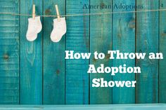 two baby shoes hanging on a clothes line with the words how to throw an adoption shower