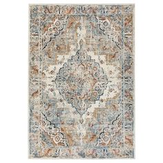 an area rug with various colors and patterns on the floor, including blue, orange, beige