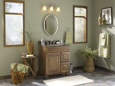 a bathroom with two sinks and mirrors in it