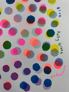 an image of colorful polka dots on white paper