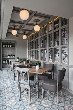 the dining room is clean and ready for guests to eat at it's long table