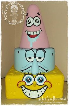 there are three spongebob cakes on top of each other, one is pink and the other is blue