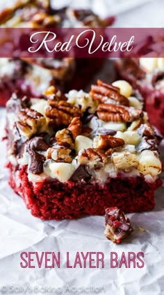 a piece of red velvet cake with pecans and nuts on top, ready to be eaten