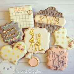 decorated cookies are arranged on a table with the names of their loved ones and date