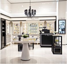 the inside of a jewelry store with chandelier