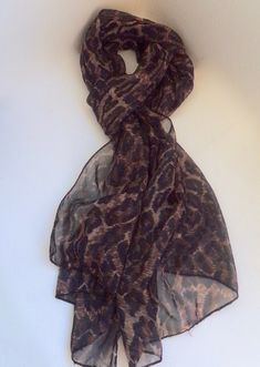 This vintage leopard print scarf is made from a sheer fabric and has a variety of uses, winter and summer. Wear the womens long scarf in various ways. The scarf is 62 inches (158cm) in length and 18 1/2 inches (47 cm) in width. It can be used as a head scarf or for the neck.  The scarf is in fairly good vintage condition but does have some pulls and a little fraying of the edges. These can be seen in the photos. If you would like to see other ReTain ReMake ReNew items: https://www.etsy.com/uk/sh Vintage Photo Frames, Leopard Scarf, Vintage Leopard, Animal Print Scarf, Sheer Scarf, Polyester Scarf, Leopard Print Scarf, Vintage Bone China, Vintage Scarf