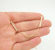 This is a tiny names necklace with 1, 2, 3, 4 pendants and 0.5in chain spaces between names. I make this mom necklace in 14K yellow gold, 14K rose gold, 14K white gold, with a cable chain. Different chain lengths are available. I could add a diamond or a birthstone to the necklace - contact me. Jewelry Mexican, Necklace With Kids Names, Names Necklace, Mommy Necklace, Grandma Necklace, Handwriting Jewelry, Dainty Diamond Necklace, Mother Jewelry, Family Necklace