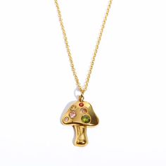 Elevate your style with a sparkly 18k stainless steel mushroom necklace made complete with colorful crystals for an out-of-this-world look. Get ready to shine bright like the sun! Mushrooms are a symbol of spiritual growth and change. They symbolize good luck and new beginnings! 18k Gold Plated Stainless Steel Pendant Measures 25mmx20mm Chain Length is 16" + 2" extender Water and Tarnish Resistant: Crafted to withstand everyday wear and tear Hypoallergenic: Made with high-quality materials and i Mushroom Locket Necklace, Colorful Crystals, Mushroom Necklace, Mushroom Pendant, Mushroom Jewelry, Lucky Symbols, Cute Charms, Stainless Steel Pendant, Fashion Jewelry Necklaces