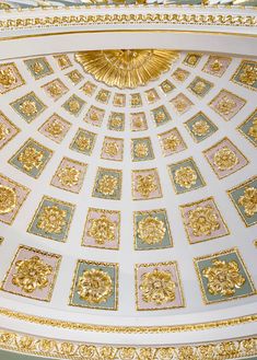 an ornate ceiling with gold and blue decorations