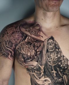 a man with tattoos on his chest is looking at the camera while wearing a hat