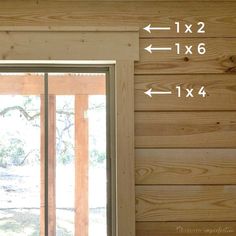 the measurements for sliding glass doors are shown in front of a wood paneled wall