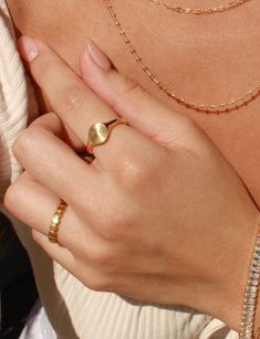 Details: Make a statement with our Coco Ring! Made with gold plated stainless steel, this ring is perfect for everyday wear. You can confidently stack your rings without worrying about any tarnishing. Our Coco Ring is also skin friendly and waterproof, so you can wear it all day and even to the beach! It's a great addition to your jewelry collection and adds a touch of elegance to any outfit. * Gold Plated Stainless Steel (PVD Plating) * Size Options: US 6 - 8 ►WATER-SAFE: Our jewelry uses a spe Dainty Gold Signet Ring For Everyday, Dainty Engraved Gold Round Band Ring, Gold Dainty Engraved Ring Tarnish Resistant, Gold Open Ring Jewelry For Everyday, Dainty Gold Engraved Tarnish-resistant Ring, Gold Minimalist Stainless Steel Ring, Dainty Gold Engraved Ring Tarnish Resistant, Minimalist Gold Stainless Steel Rings, Gold Stainless Steel Minimalist Ring