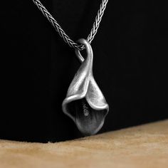 Lily Pendant, Calla Lily Unique Silver Pendant Necklace, Oxidized Silver 3D Lily Flor Charm Necklace, Floral Silver Men Jewelry, Mother Gift Made of 925 silver and handcrafted by hand, this ring is not only an accessory piece that complements your daily elegance, but also has details that will reflect your character and style. It is also a great gift to give to your loved ones on their special days. At SavisSilver, we always give importance to the satisfaction of our customers, we recommend you Oxidized Silver, Calla Lily, Silver Pendant Necklace, Silver Man, Personalized Products, Silver Pendant, Mother Gifts, Charm Necklace, Favorite Jewelry