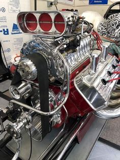 an engine on display in a showroom for people to see and do something else