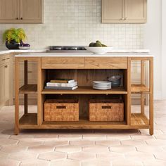 a kitchen island with baskets under it