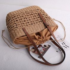 SPECIFICATIONSBrand Name: BOBAGOrigin: Mainland ChinaCN: GuangdongLining Material: POLYESTERPlace Of Origin: GUANG DONG ProvincePlace Of Origin: GUANG DONG ProvinceShape: Casual ToteMain Material: LinenStyle: fashionClosure Type: OPENOccasion: VersatileModel Number: Woven BagPattern Type: hollow outInterior: Interior Slot PocketInterior: Interior CompartmentGender: WOMENDecoration: NONEExterior: NONEHardness: HARDMaterial: paper ropelarge beach bag: bolsas praia femininasbeach wicker bag: beach Brown Crochet Shoulder Bag For Beach, Beige Satchel Bag For Vacation, Brown Summer Shoulder Bag For Daily Use, Brown Hobo Bag For Daily Use, Brown Hobo Bag For Daily Beach Use, Brown Large Capacity Hobo Bag For Vacation, Brown Double Handle Beach Shoulder Bag, Trendy Brown Beach Shoulder Bag, Square Beige Canvas Bag For Vacation