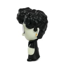 a black and white figurine with an afro wig on it's head