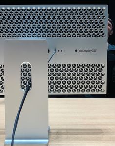 an apple product is displayed in front of a microphone and sound board at the company's showroom