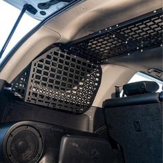 the interior of a vehicle with speakers and radio