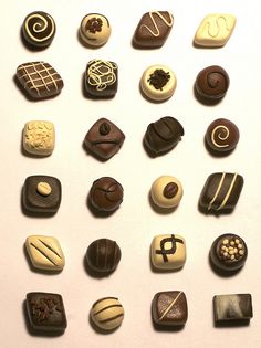 there are many different types of chocolates on the table