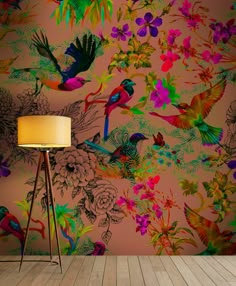 a colorful wallpaper with birds and flowers on it in an empty room next to a floor lamp