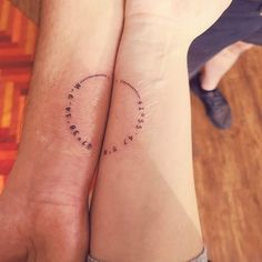 two people with matching tattoos on their arms, one has the word love written in small letters