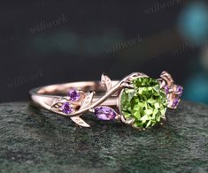 - Metal: Solid gold(10K/14K/18K white/yellow/rose gold),925 sterling silver,platinum available- Main Stone: 6.5mm round cut natural peridot- Accent Stone: round cut and marquise cut natural amethysts- Can be personalized: Yes Peridot Promise Rings, Peridot And Amethyst Ring, Amethyst And Peridot Ring, Engagement Rings Peridot, Peridot Wedding Ring, Peridot Ring Gold, Peridot Engagement Ring, Peridot Rings, Peridot Engagement Rings