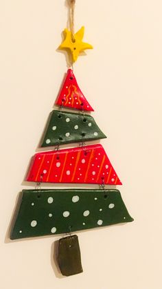 a christmas tree ornament hanging on a wall