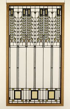 an art deco style window with geometric designs on it's glass and wood frame