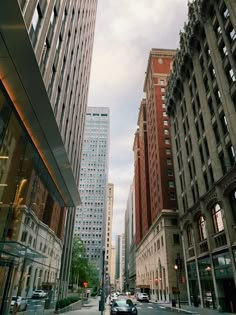 a city street with tall buildings on both sides