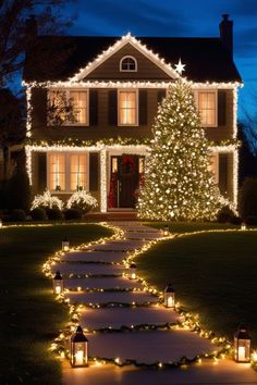 a house decorated for christmas with lights on the front porch and trees in the yard