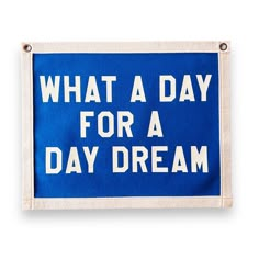 a blue and white sign that says, what a day for a day dream