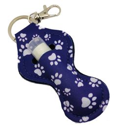 a purple and white dog paw print bottle holder