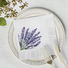 a place setting with napkins and silverware